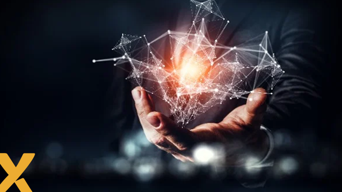 Hand van een zakenman die een digitaal netwerk met lichtpunt vasthoudt, symbool voor inzicht en controle over energieverbruik.